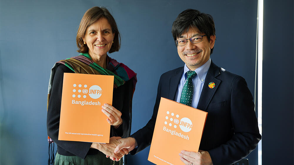 Corinne Henchoz Pignani, Chargée d’affaires a.i, Embassy of Switzerland in Bangladesh and Masaki Watabe, Representative a.i. of UNFPA Bangladesh, shakes hand after the signing ceremony at Switzerland Embassy.